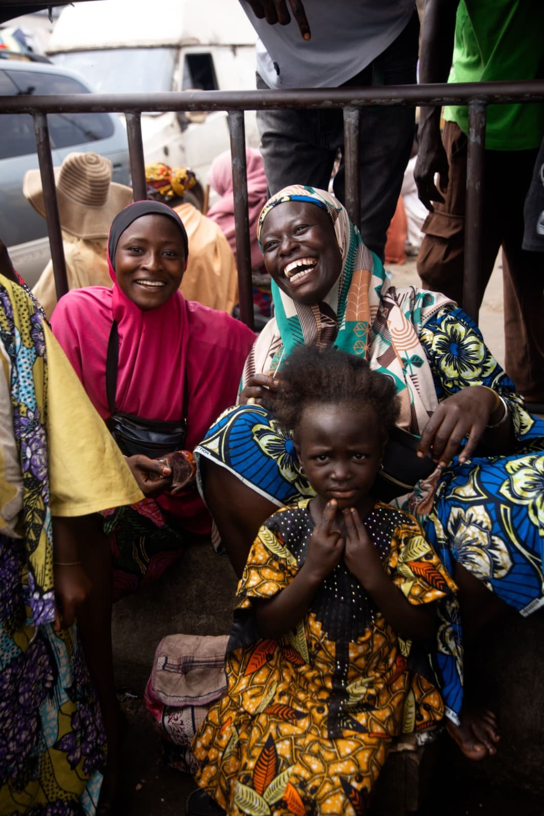 Families smiling in a community gathering