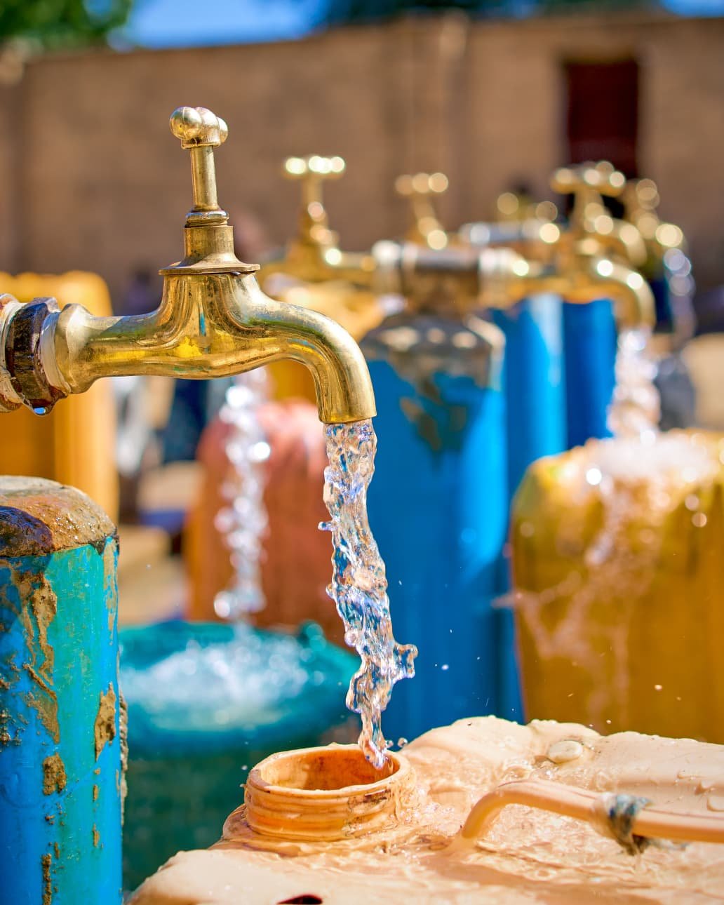 Water flowing from community taps