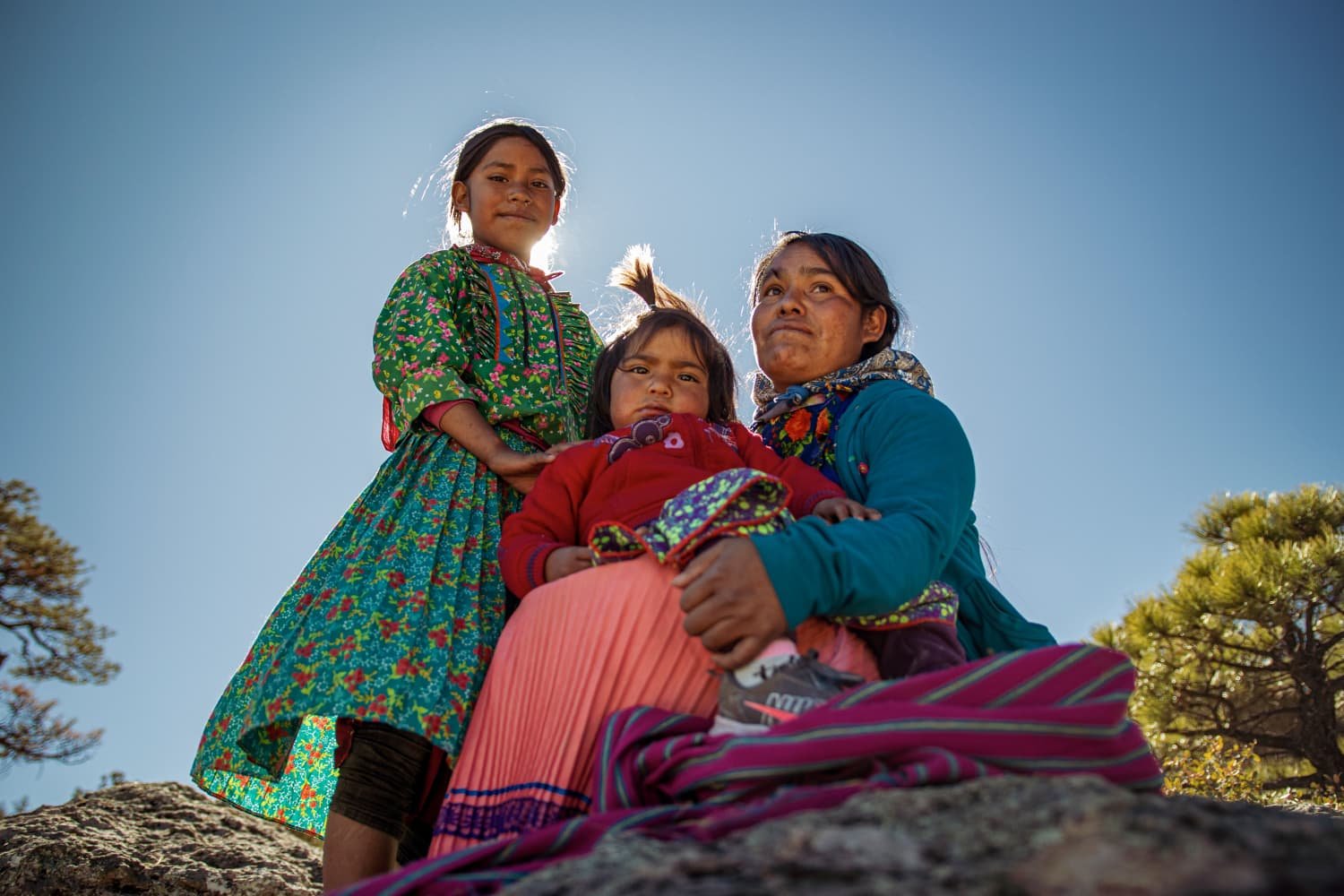 Mother with children under a clear sky