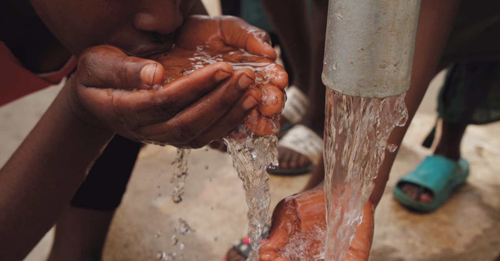 Hands receiving clean water from a tap